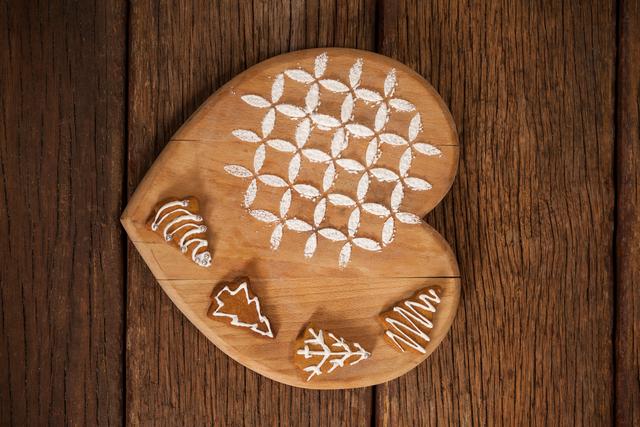 Ginger bread decorated on wooden board during christmas time