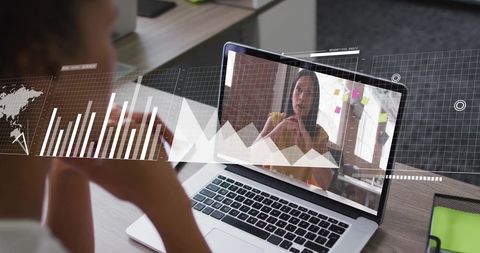 Virtual Meeting Amidst Financial Data Analysis on Laptop Screen