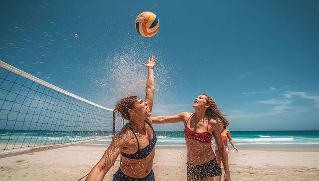 Energetic Beach Volleyball Match on Sandy Shoreline