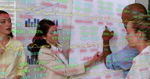 Team Analyzing Data with Digital Charts and Stock Market Trends