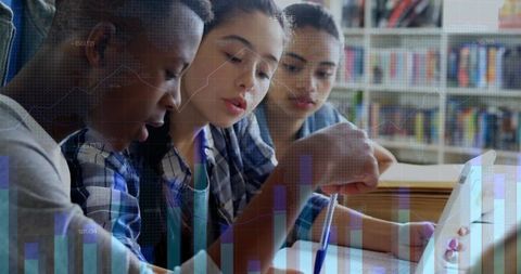 Diverse students collaborating on academic project in library