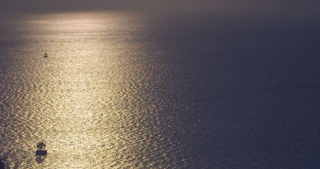 Golden Sunset Over Calm Ocean with Distant Boats Silhouetted - Download Free Stock Images Pikwizard.com