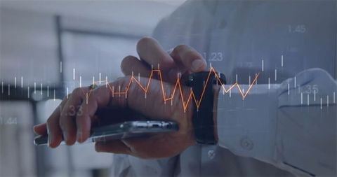 Businessman Overlays Real-Time Financial Data on His Tech Devices