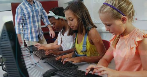 Diverse Children Learning Computer Skills with Teacher Guidance - Download Free Stock Images Pikwizard.com