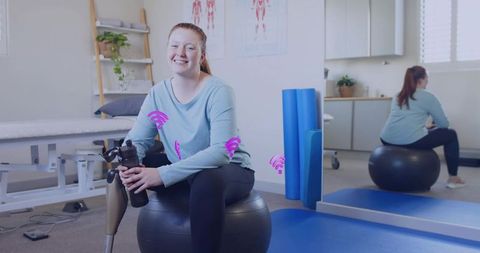 Woman with Prosthetic Leg Smiling in Rehabilitation Clinic