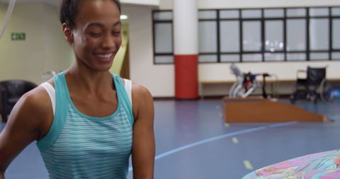 Joyful Young Woman Engaging in Energizing Workout Indoors