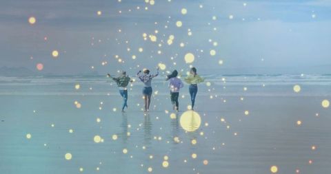 Friends Enjoy Carefree Beach Walk with Magical Glow