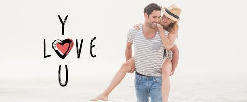 Happy couple embracing love on sunlit beach