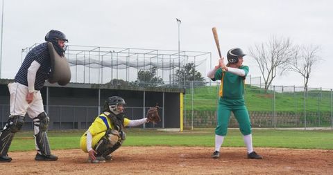 Youth Baseball Player Prepares to Swing at Home Plate