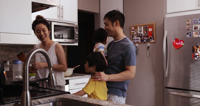 Smiling Family Cooking Together in Modern Kitchen - Download Free Stock Images Pikwizard.com