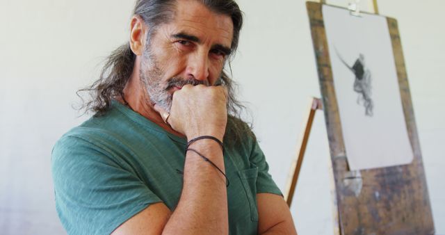 Pensive Male Artist with Beard in Front of Easel - Download Free Stock Images Pikwizard.com