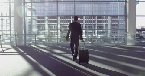 Businessman Walking Inside Modern Airport Terminal - Download Free Stock Images Pikwizard.com