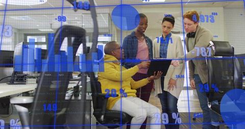 Seated Presenter Pointing at Tablet in Office Collaborating on Data Dashboards