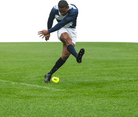Transparent male rugby player kicking ball on field