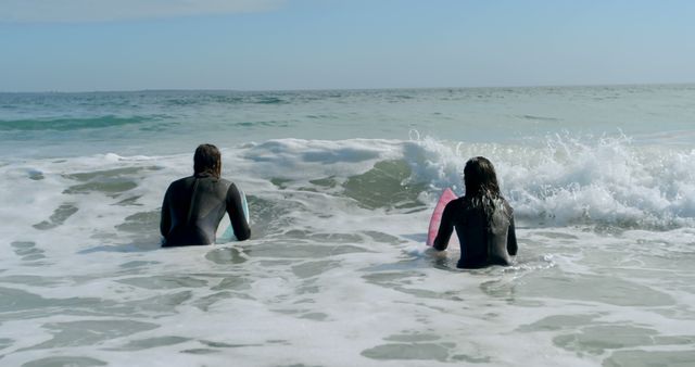 Companion Surfers Waiting for Waves in Ocean - Download Free Stock Images Pikwizard.com