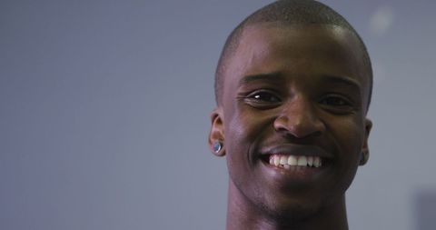 Smiling Young Dancer with Gauge Ear Piercings - Download Free Stock Images Pikwizard.com