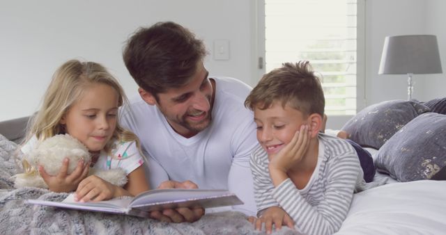 Father Reading Storybook to Son and Daughter in Bedroom - Download Free Stock Images Pikwizard.com