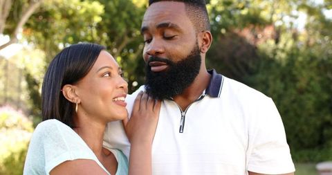 Diverse couple sharing a romantic moment outdoors