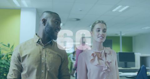 Team discussion in modern office with technology theme