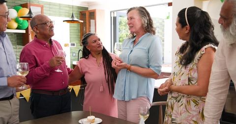 Senior Woman Celebrating Birthday with Diverse Group of Friends