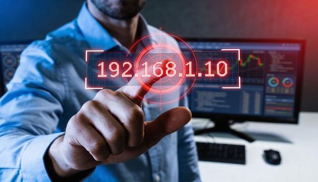 It professional pointing at holographic ip address 192.168.1.10 cybersecurity interface