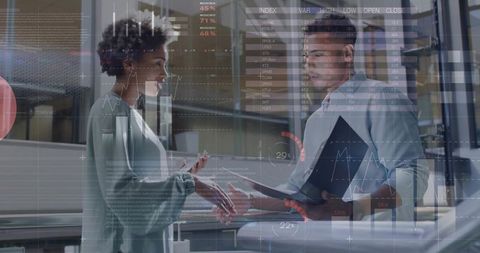 Business Analysts Reviewing Data with Futuristic Overlays in Modern Office