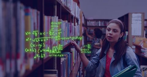 Female student exploring digital data in library