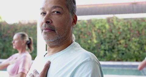 Serene Outdoor Yoga Class by Poolside Patio