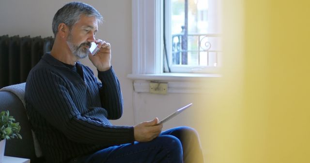 Ethnic Middle Aged Man Sneezing while Using Tablet at Home - Download Free Stock Images Pikwizard.com