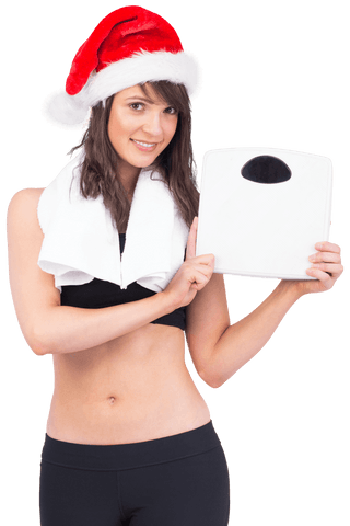 Festive Fitness Woman Holding Scale in Santa Hat on Transparent Background