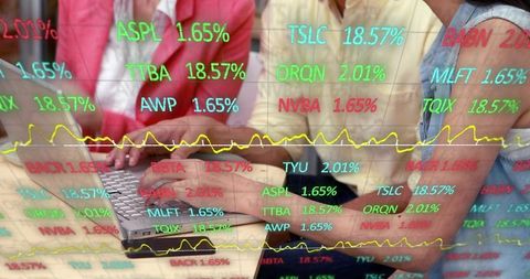 Team analyzing market data using laptop with colorful stock ticker overlay and charts