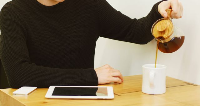 Man Pouring Fresh Coffee in Mug at Work Desk - Download Free Stock Images Pikwizard.com