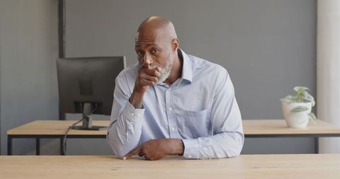 Businessman Engaging in Discussion During Meeting in Office - Download Free Stock Images Pikwizard.com