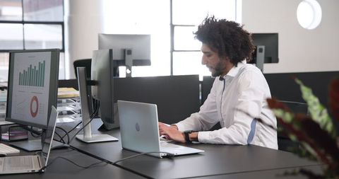 Business Professional Engaging in Financial Analysis in Modern Office