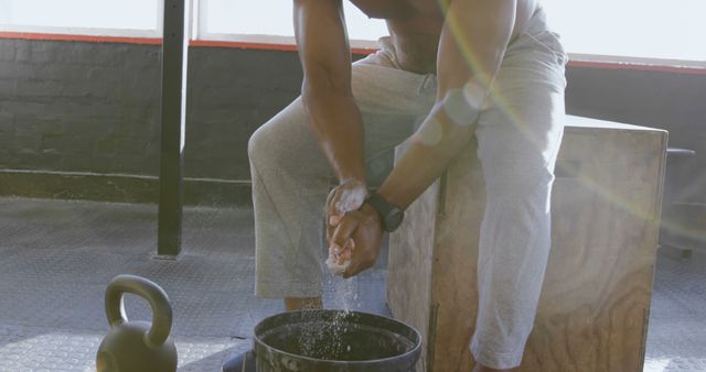 Male Athlete Applying Chalk on Hands Before Workout in Gym - Download Free Stock Images Pikwizard.com