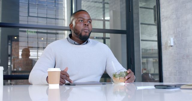 Businessman Having Lunch Break in Modern Office - Download Free Stock Images Pikwizard.com