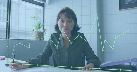 Financial data analysis with asian businesswoman and graph overlay