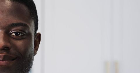 Close-Up Smiling Man Against Minimalist White Background