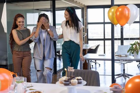 Joyful surprise office party with elegant decor and treats