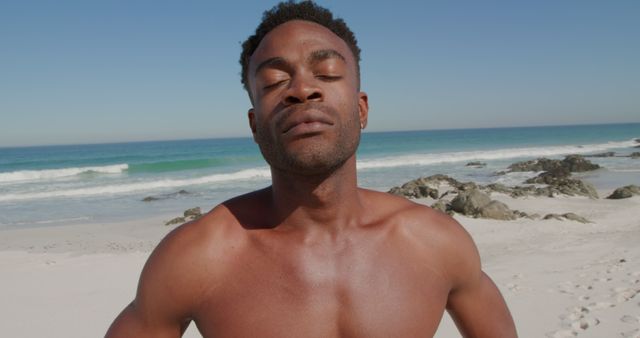 Man Relaxing on Beach with Eyes Closed Under the Sun - Download Free Stock Images Pikwizard.com