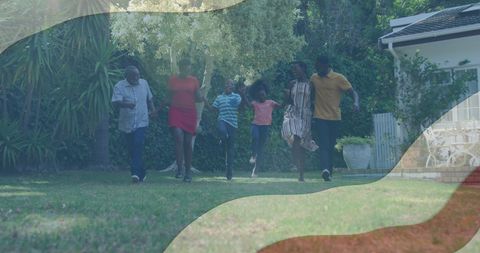 African American Family Celebrating in Backyard with USA Flag Overlay