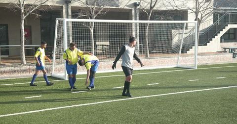 Youth Soccer Players on Field Preparing for Training Session