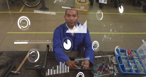 Mechanic Analyzing Digital Data for Equipment Repair Efficiency