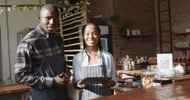 Small Business Owners Using Digital Tablet in Modern Cafe - Download Free Stock Images Pikwizard.com