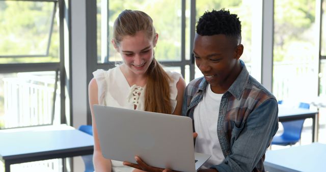 Diverse Students Collaborating on Laptop in Modern Classroom - Download Free Stock Images Pikwizard.com