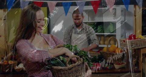 Smiling woman holding wicker basket selecting fresh greens at rustic farmers market stall
