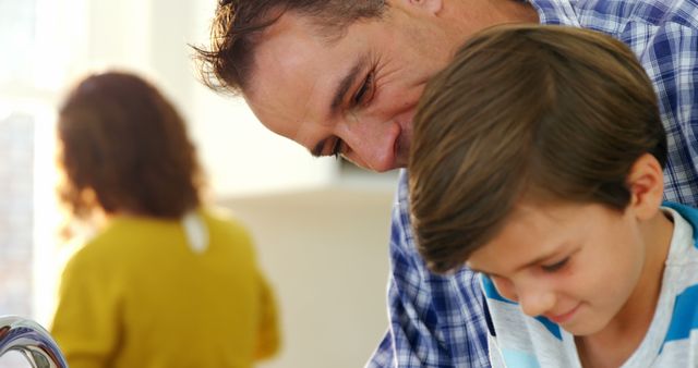 Father and Son Having Fun in Kitchen together - Download Free Stock Images Pikwizard.com