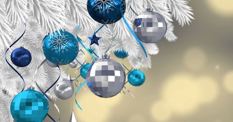 Festive Christmas Decorations on Snowy White Tree