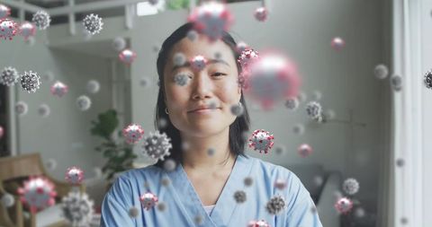 Healthcare Worker in Scrubs With Digital Overlay of Coronavirus Models