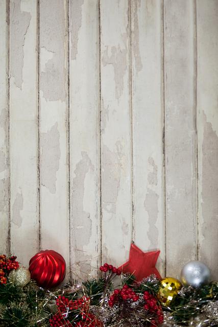 Festive Christmas Decorations on Rustic Wooden Plank - Download Free Stock Photos Pikwizard.com